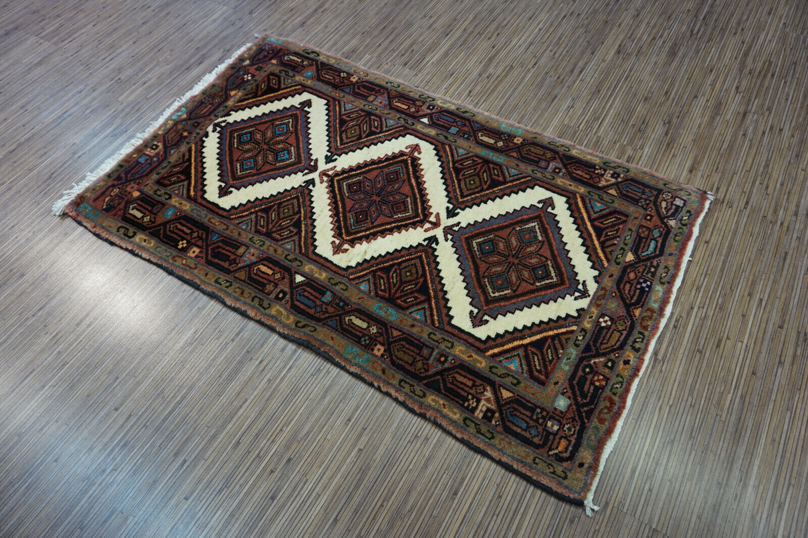Ideal size displayed in a detailed shot of the 2.3' x 3.9' Vintage Rug