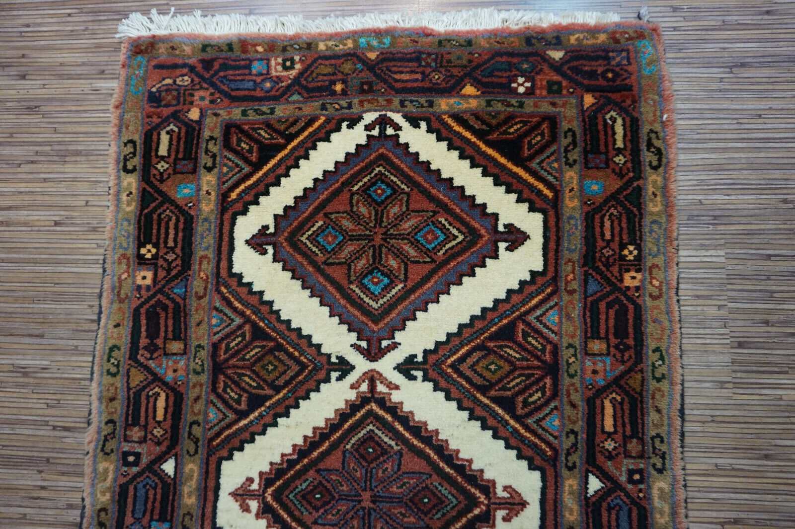 Rich earthy tones adding a vintage look to the Handmade Vintage Rug