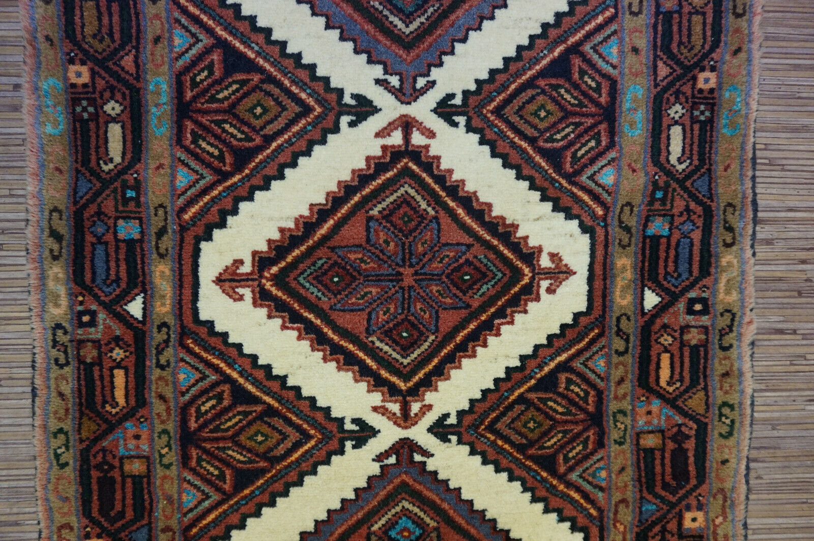 Detailed geometric and symmetrical designs in brown, white, blue, and red