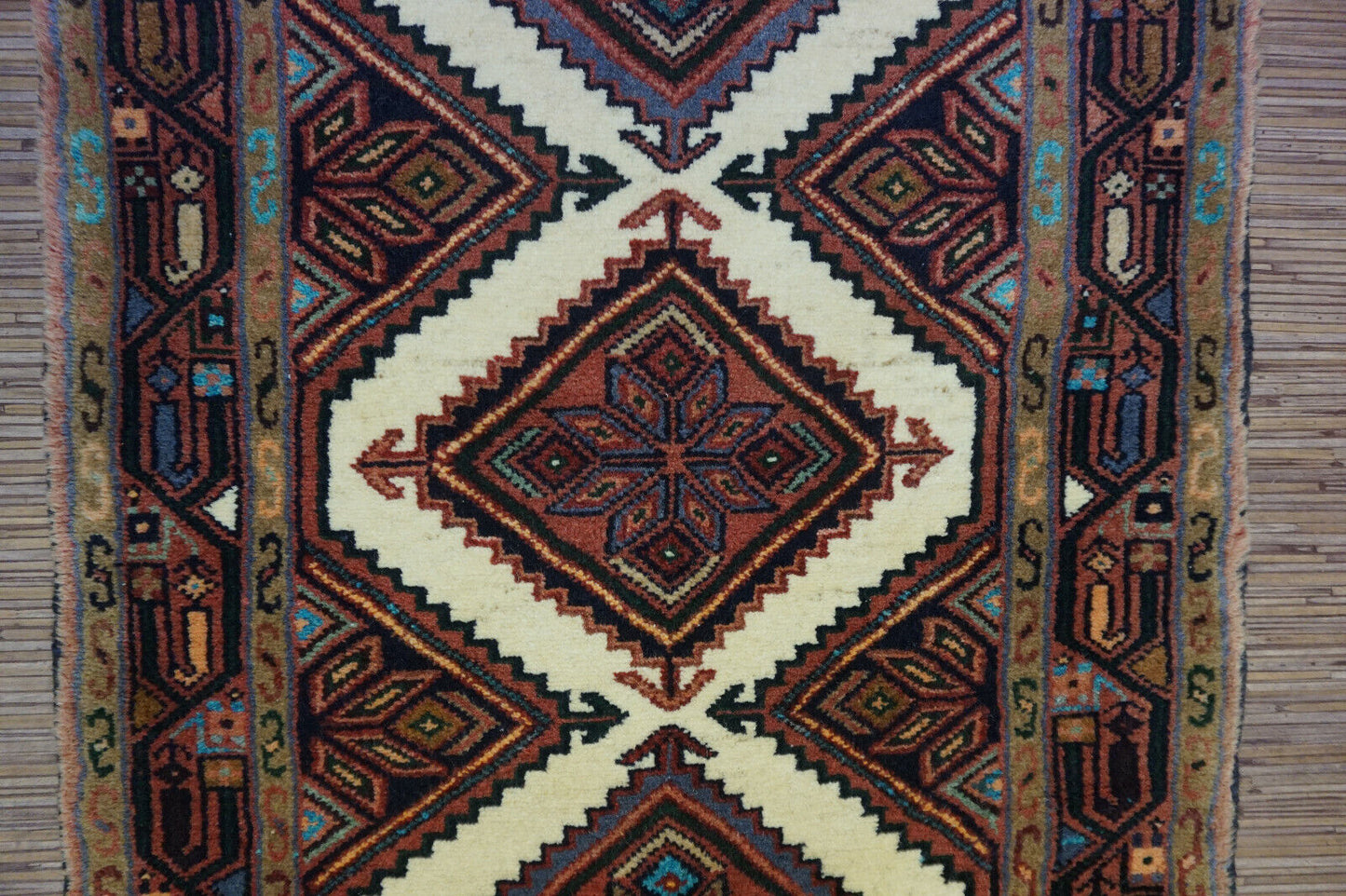 Detailed geometric and symmetrical designs in brown, white, blue, and red