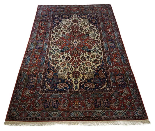 Handmade Antique Persian Style Isfahan Rug showcased in a luxurious living room setting