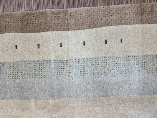 Close-up of the thick pile and earthy color palette on the Handmade Traditional Gabbeh Rug