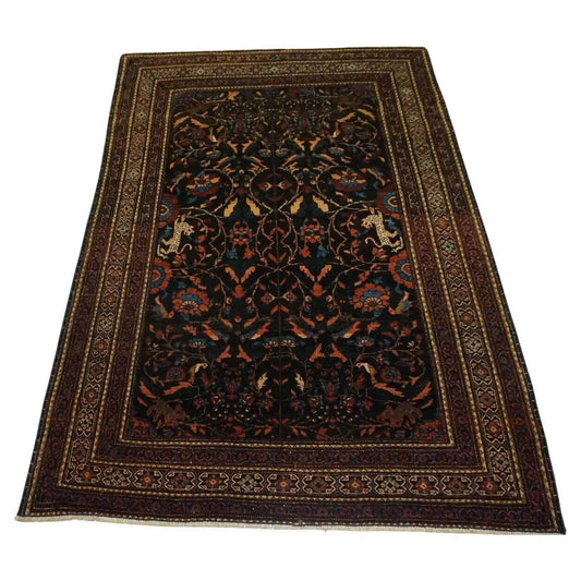 Handmade Antique Persian Tehran Rug displayed in a well-lit room with elegant decor