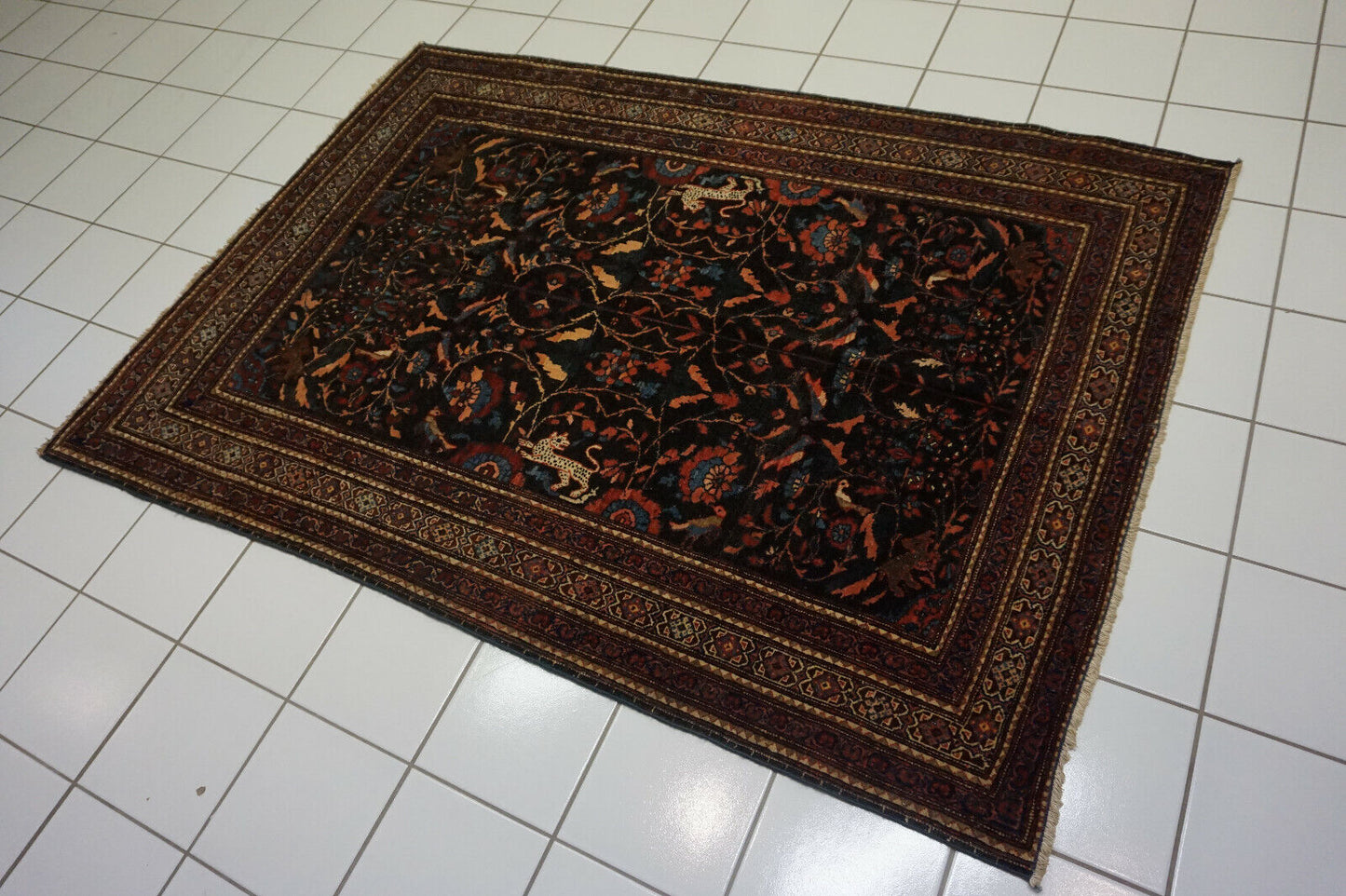 Detailed close-up of the sumptuous texture inviting touch on the Handmade Antique Persian Tehran Rug