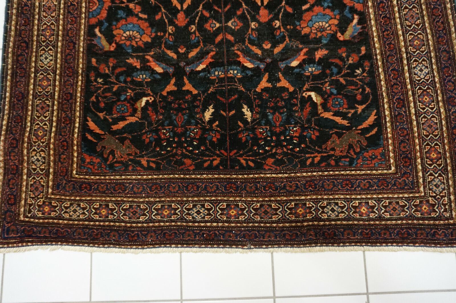 Side view of the Handmade Antique Persian Tehran Rug demonstrating its luxurious wool material