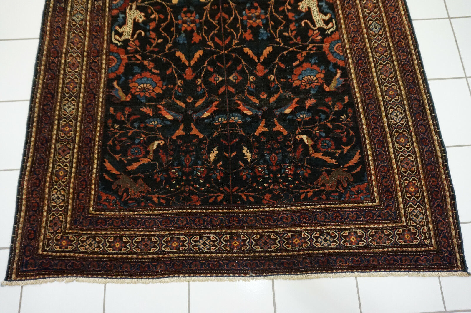 Close-up of the geometric borders framing the central design on the Handmade Antique Persian Tehran Rug