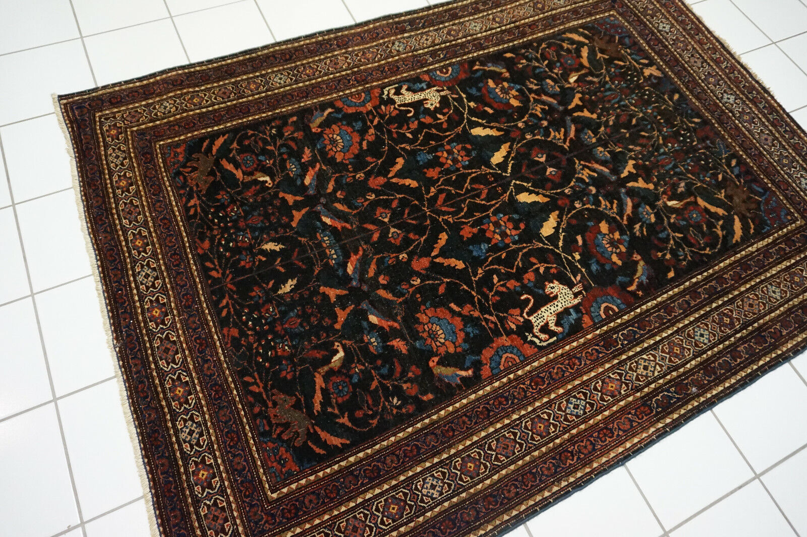 Angled shot of the Handmade Antique Persian Tehran Rug complementing interior decor