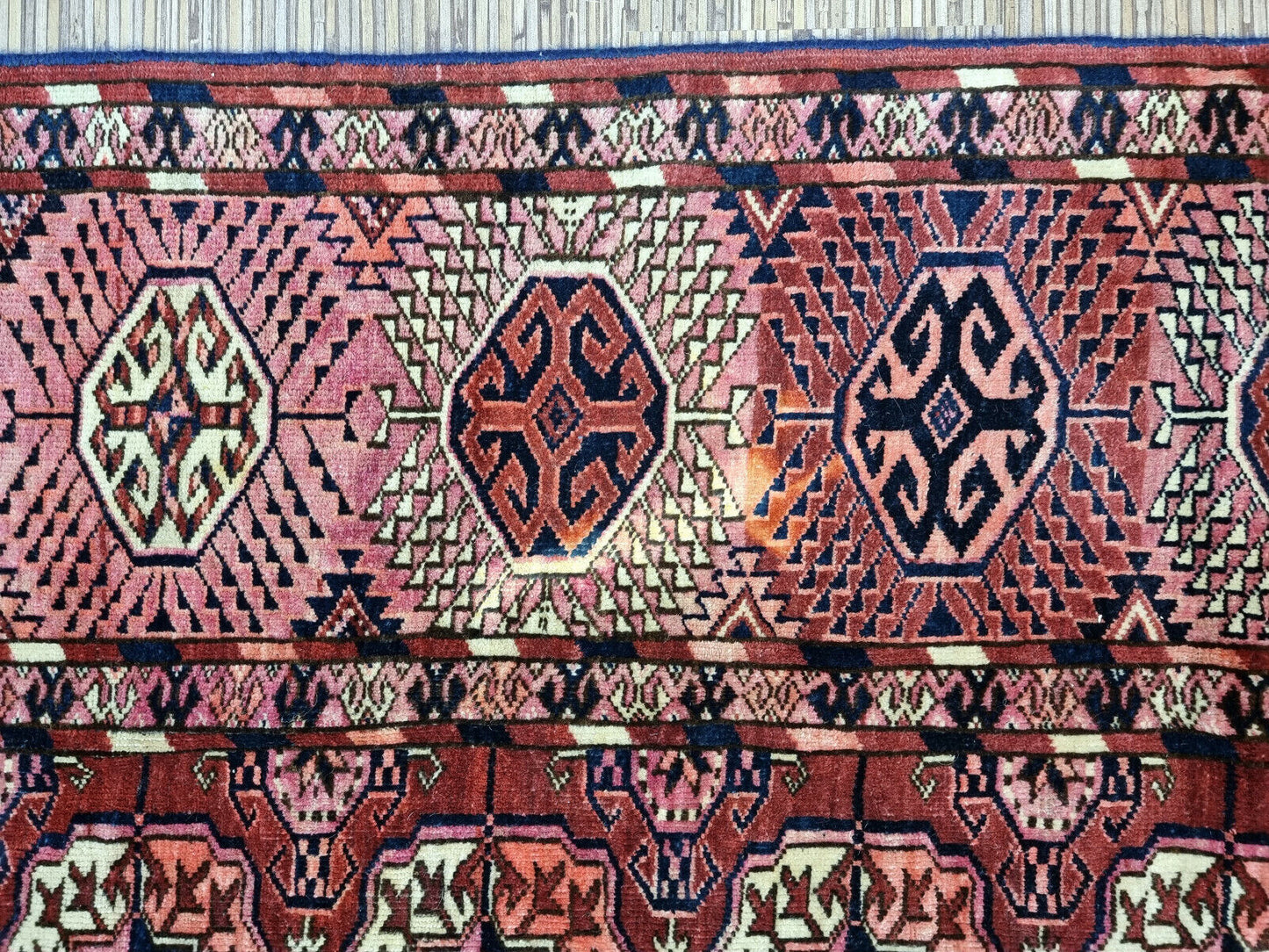 Close-up of traditional Turkmen motifs on Handmade Antique Turkmen Tekke Rug - Detailed view showcasing the intricate designs representing Turkmen culture and heritage.