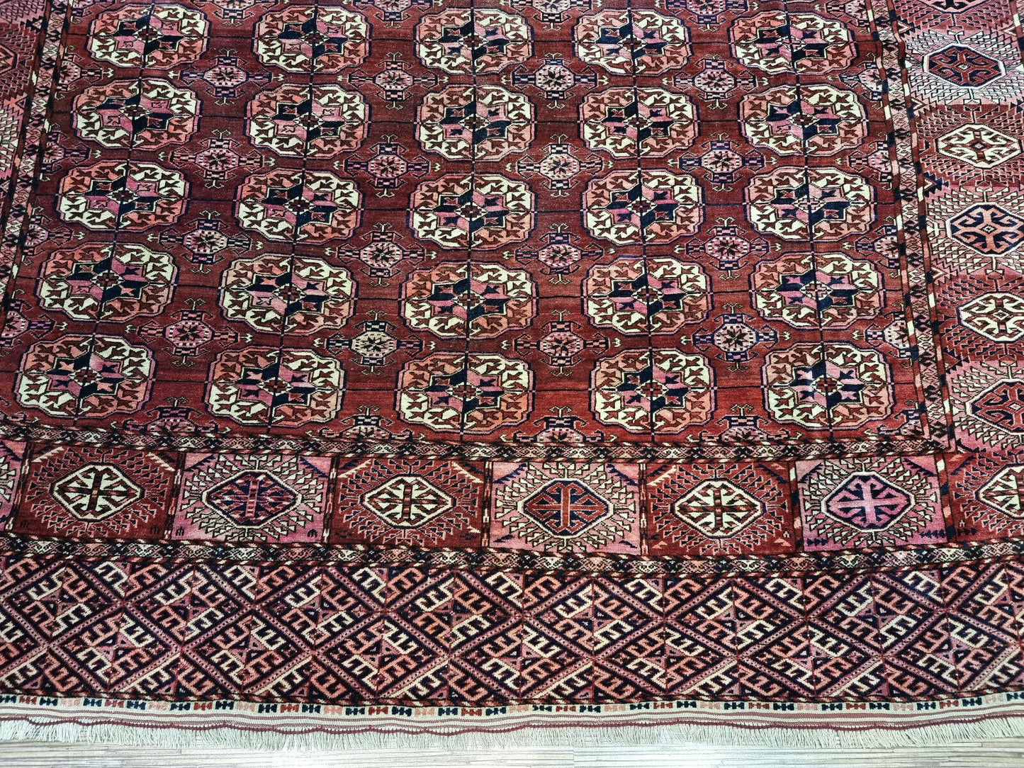 Close-up of well-preserved appearance on Handmade Antique Turkmen Tekke Rug - Detailed view showcasing the well-preserved condition of the rug despite its age.