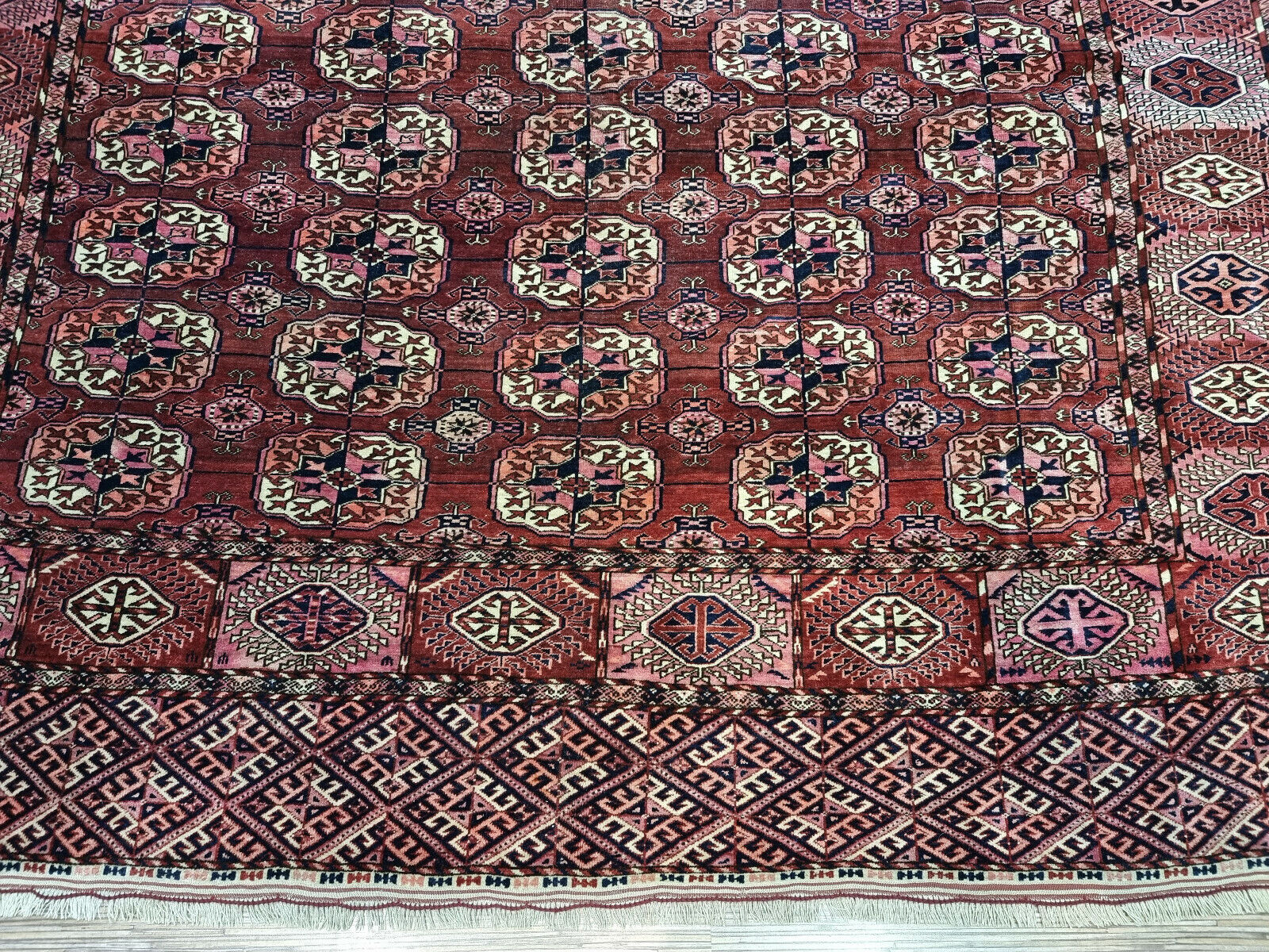 Close-up of well-preserved appearance on Handmade Antique Turkmen Tekke Rug - Detailed view showcasing the well-preserved condition of the rug despite its age.