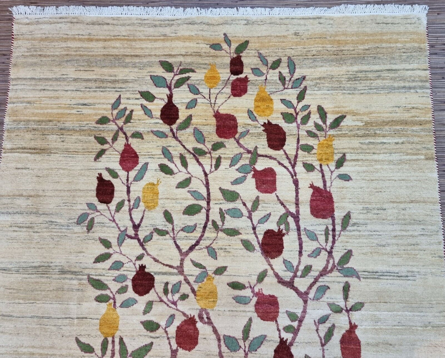 Vintage Gabbeh Rug (1970s) - Cream-colored background contrasting beautifully with the "Tree of Plenty" design. (Close-up)