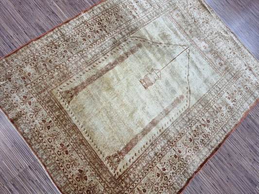 Antique Silk Tabriz Prayer Rug (Early 20th Century): Close-up view of the intricate silk pile and muted color palette.