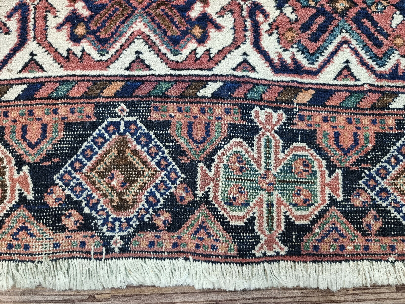 Handwoven masterpiece: Afshar rug (1920s) in rich colors and intricate patterns.