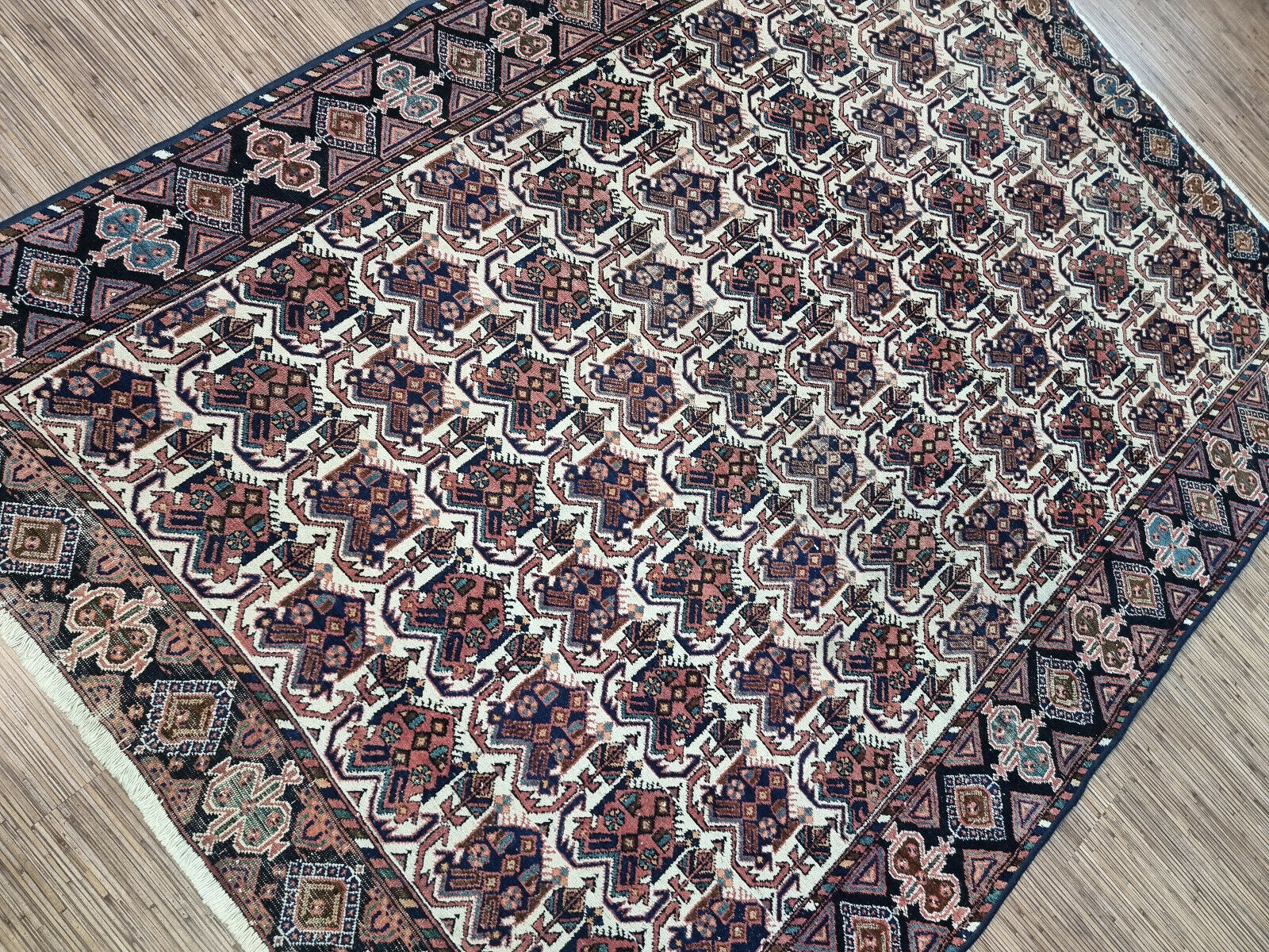 Immerse your home in history with this intricate 1920s Persian rug (5.3' x 6.9').