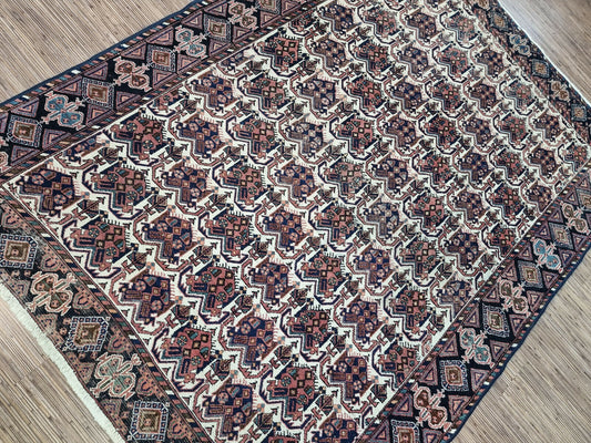 Immerse your home in history with this intricate 1920s Persian rug (5.3' x 6.9').