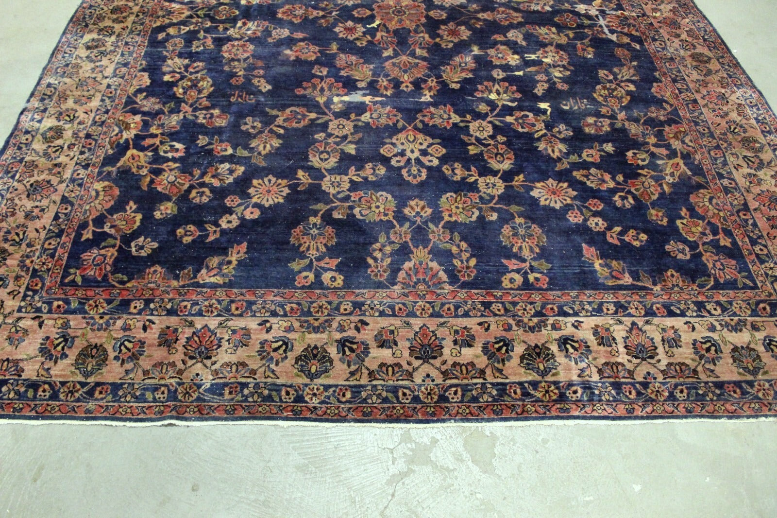 Handmade Persian Sarouk rug featuring deep red and navy blue hues

