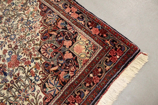 Handmade Persian Bidjar rug featuring deep navy and warm red hues

