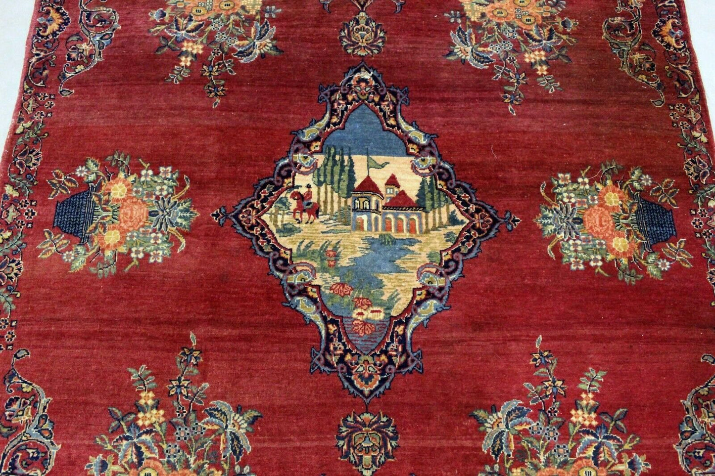 Warm and Inviting Red Base Color with Complementary Blue, Gold, and White Accents on Persian Kerman Rug - 1920s