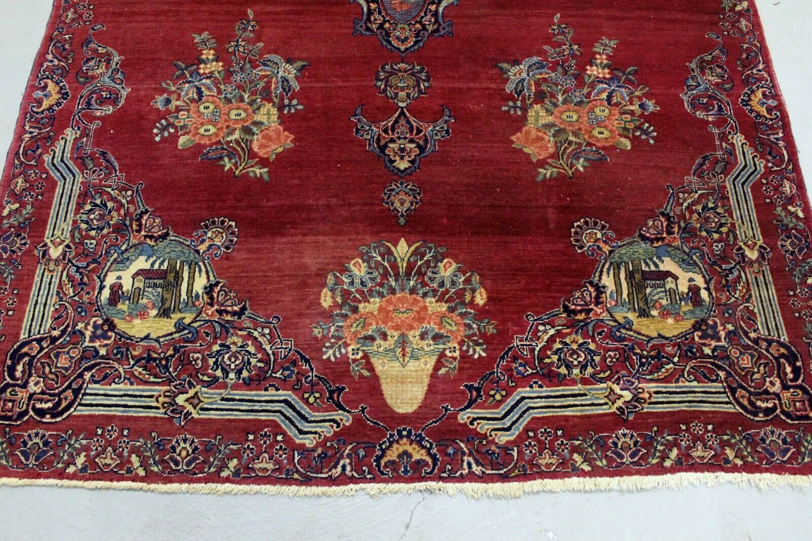 Intricate Floral Patterns and Ornate Detailing Surrounding Central Pictorial Elements on Antique Kerman Rug - 1920s