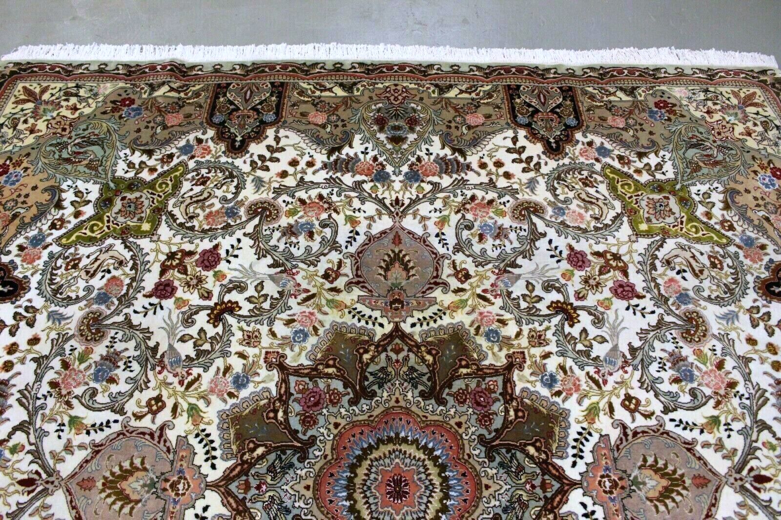 Close-up of central medallion on Handmade Vintage Persian Tabriz Rug - Detailed view highlighting the intricate floral motifs and geometric shapes.