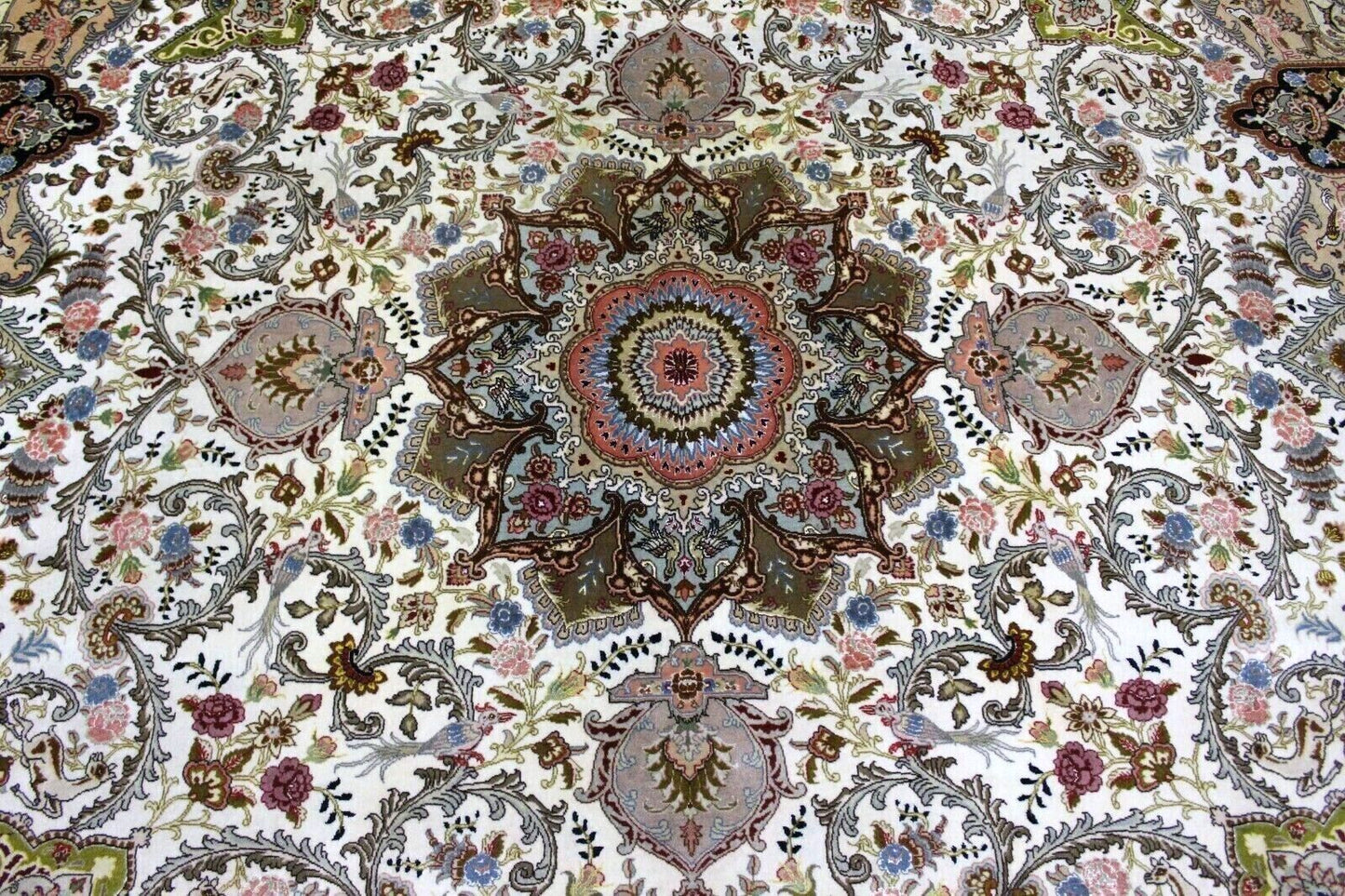 Close-up of floral motifs on Handmade Vintage Persian Tabriz Rug - Delicate flowers and vines intertwined in rich reds, blues, and greens.