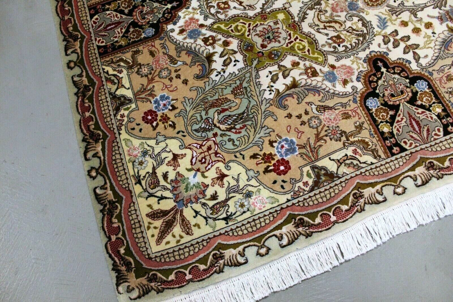  Close-up of intricate patterns on Handmade Vintage Persian Tabriz Rug - Detailed view showcasing the array of patterns, including floral motifs and ornate borders.