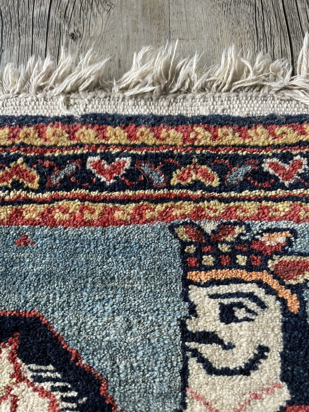 Close-up of remarkable design on Handmade Antique Persian Lilihan Collectible Rug - Detailed view showcasing the remarkable design featuring a lady and horseman that sets this rug apart.