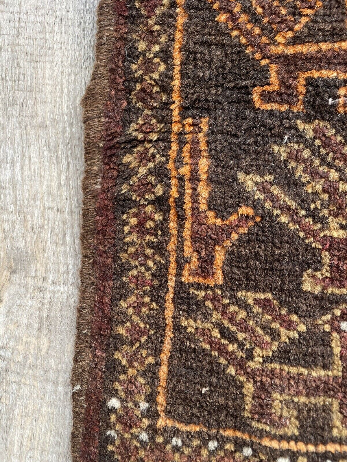 Close-up of craftsmanship on Handmade Vintage Afghan Baluch Collectible Rug - Detailed view highlighting the meticulous craftsmanship involved in creating the rug.
