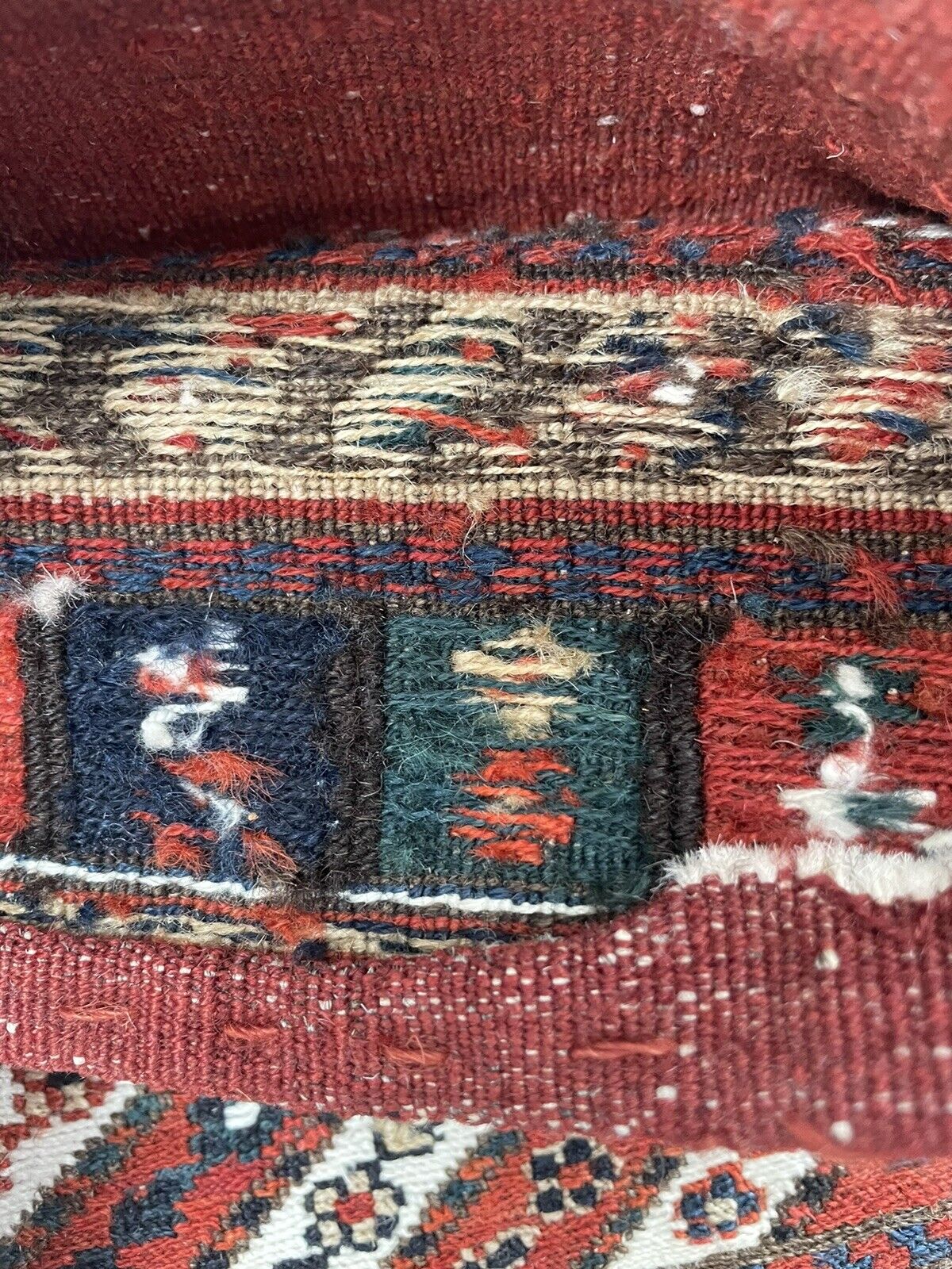 Close-up of intricate diagonal stripes on Handmade Vintage Persian Kurdish Salt Bag - Detailed view showcasing the diagonal stripes filled with geometric motifs at the center of the bag.