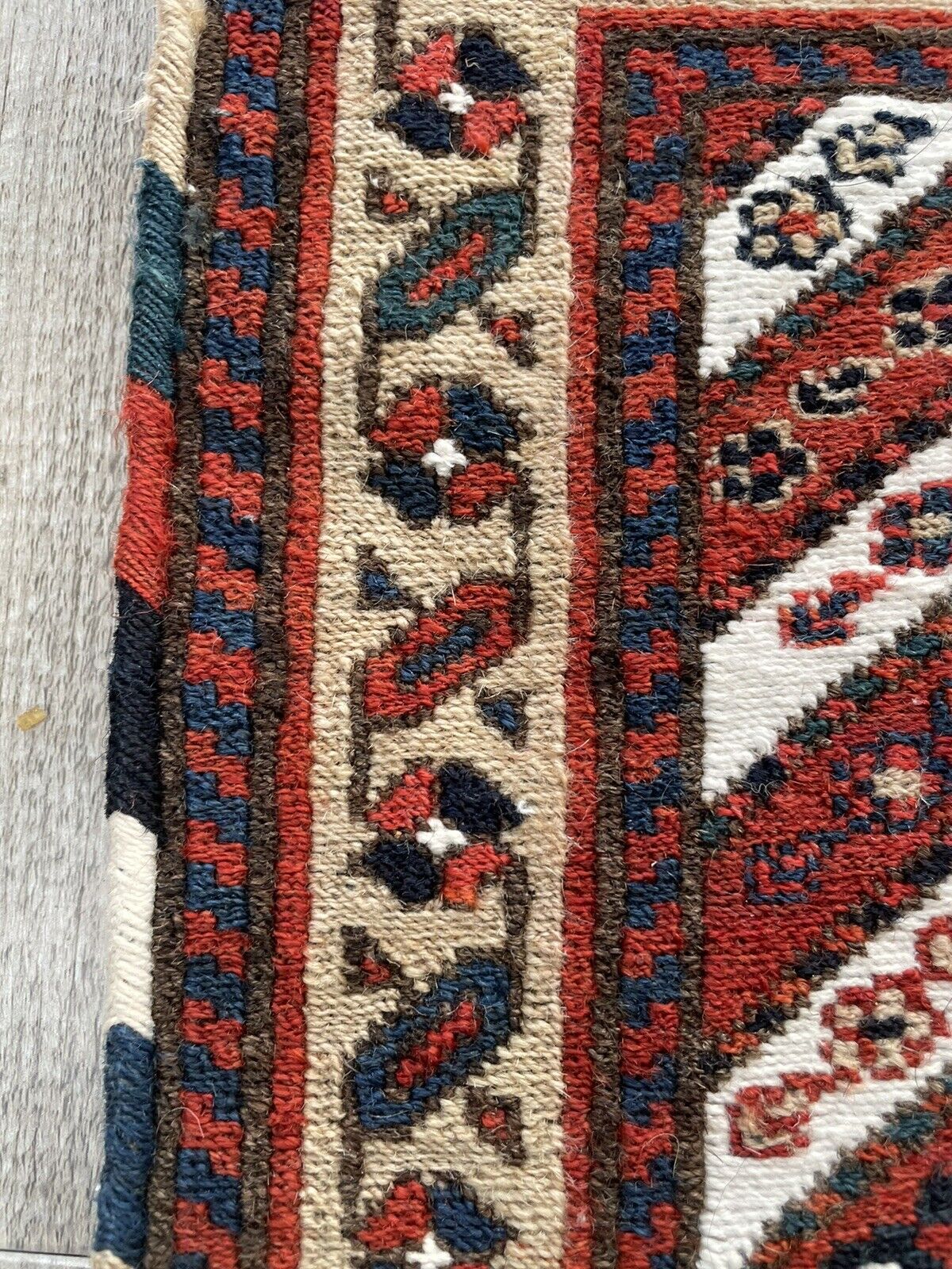 Close-up of craftsmanship on Handmade Vintage Persian Kurdish Salt Bag - Detailed view highlighting the meticulous craftsmanship involved in weaving the intricate patterns.