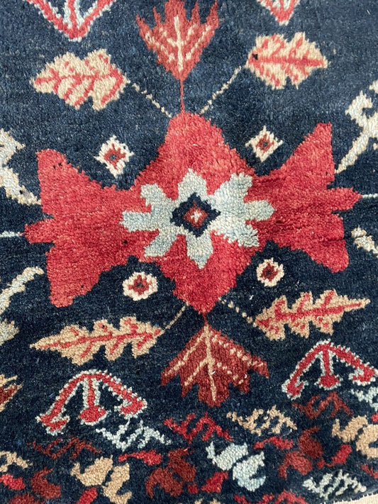 Close-up of intricate designs on Handmade Vintage Persian Hamadan Salt Bag - Detailed view showcasing the intricate symmetrical patterns woven into the salt bag's design.