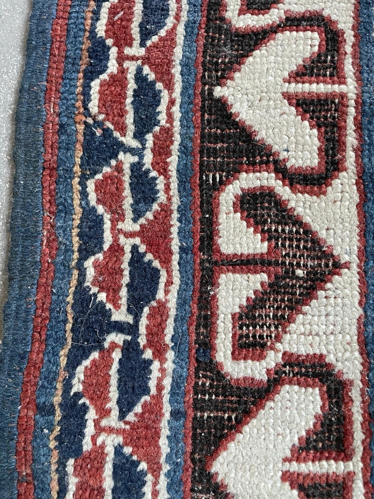 Close-up on the guard borders with their repeating geometric shapes.

