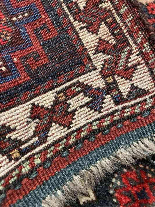 Square textile with vibrant natural dye colors

