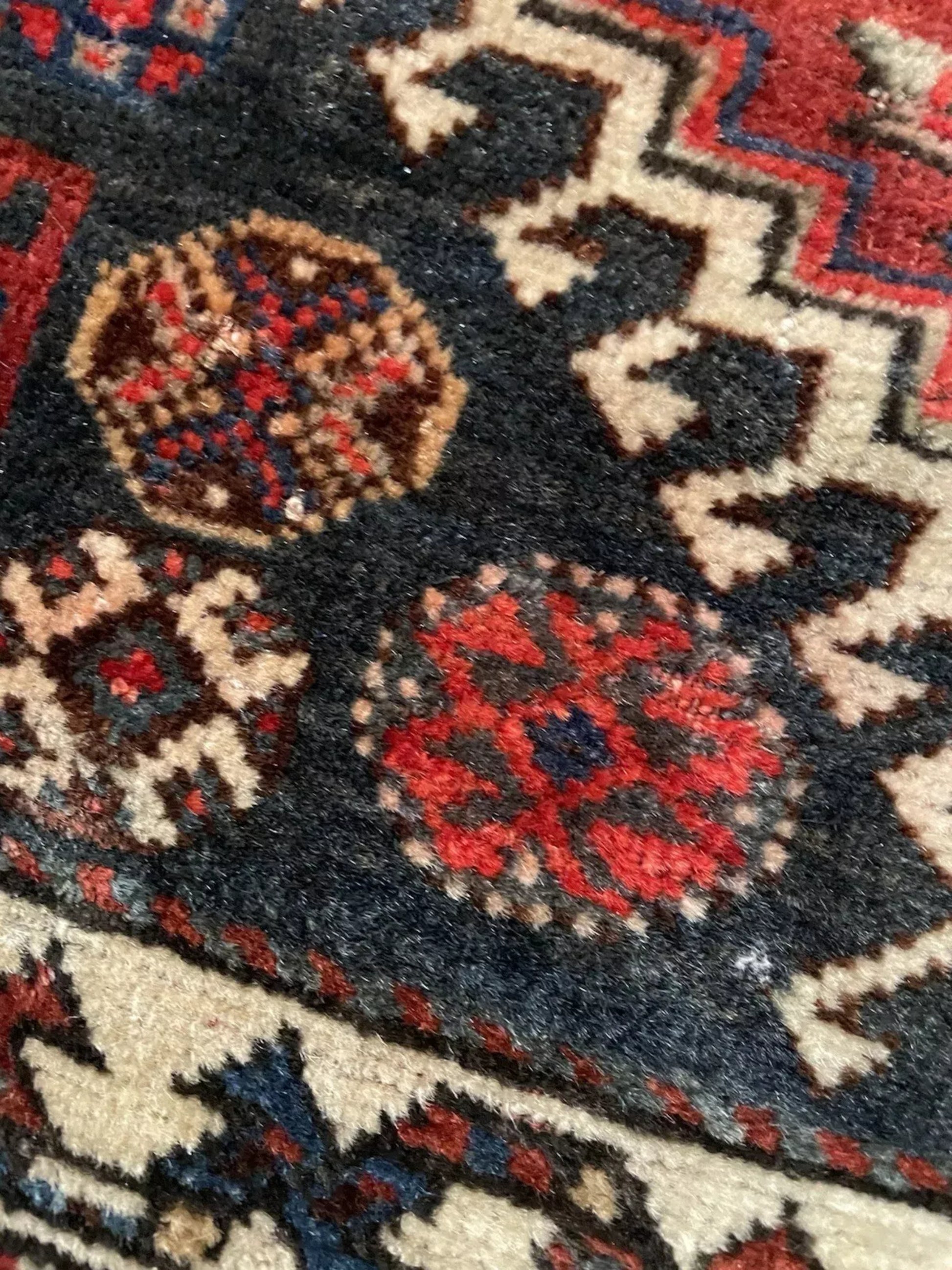 Close-up of stylized animal and medallion designs

