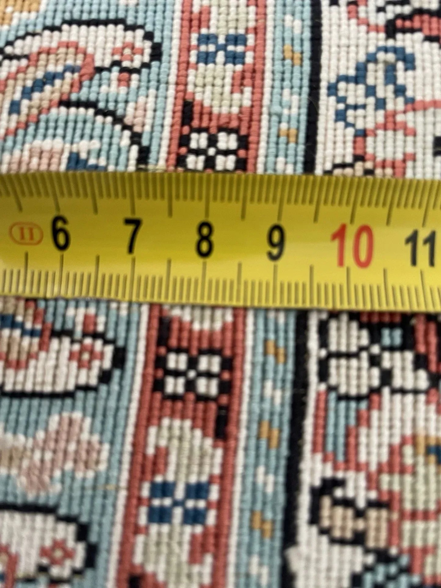 Close-up of silk knotting detail and luster

