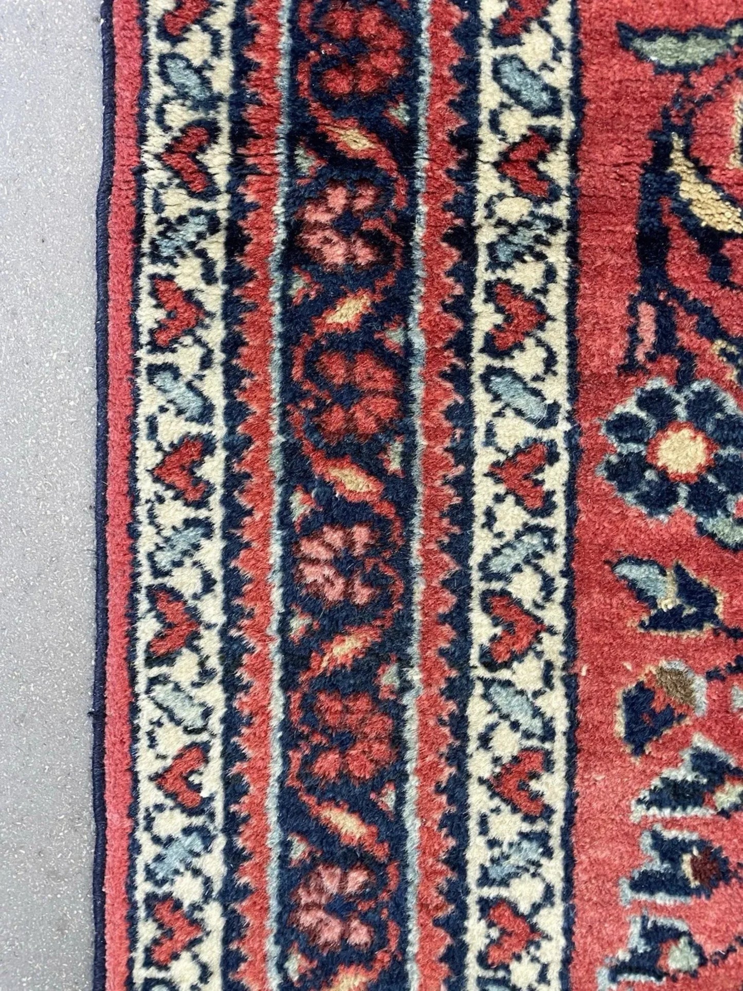 Color harmony between pink field and blue motifs

