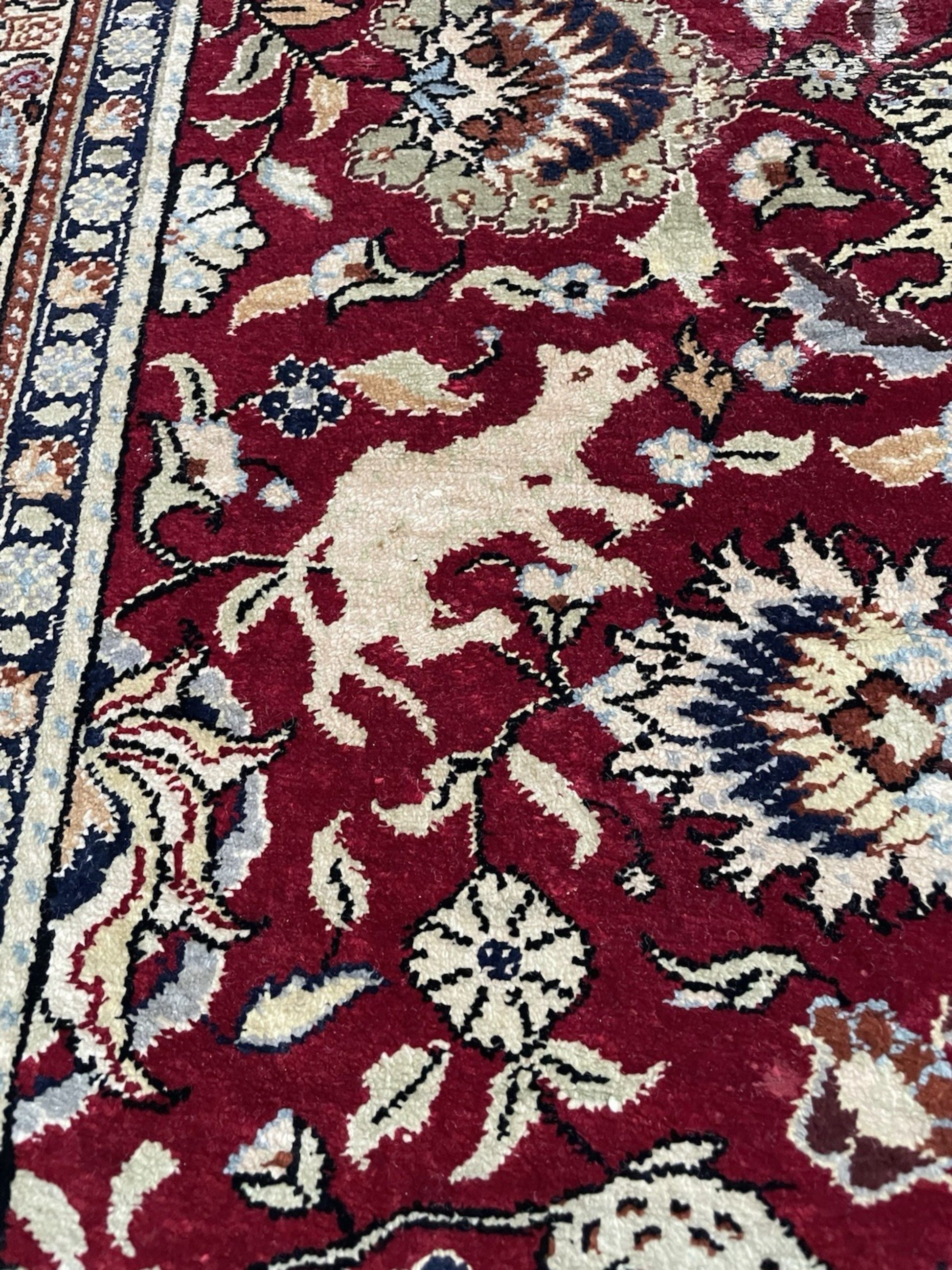 Color contrast between burgundy field and ivory motifs

