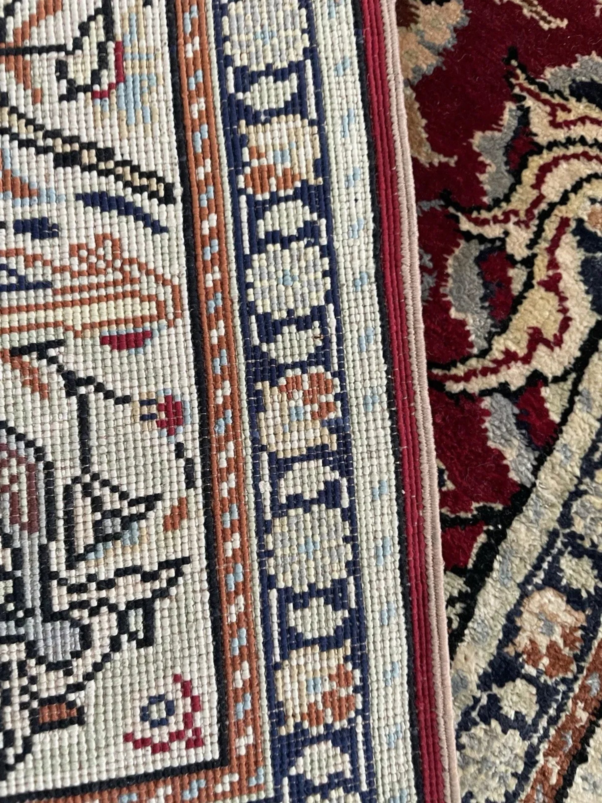 Close-up of silk knotting and luminous pile

