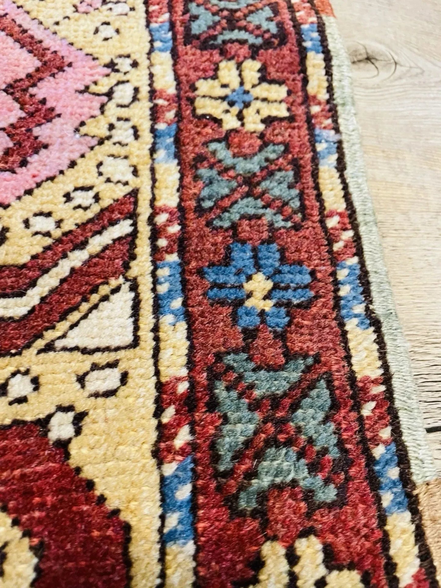 Bold central medallion on deep red field

