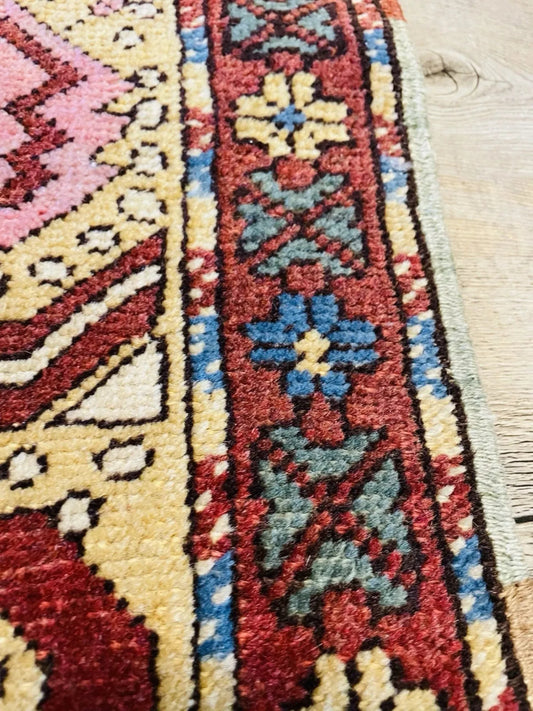 Bold central medallion on deep red field

