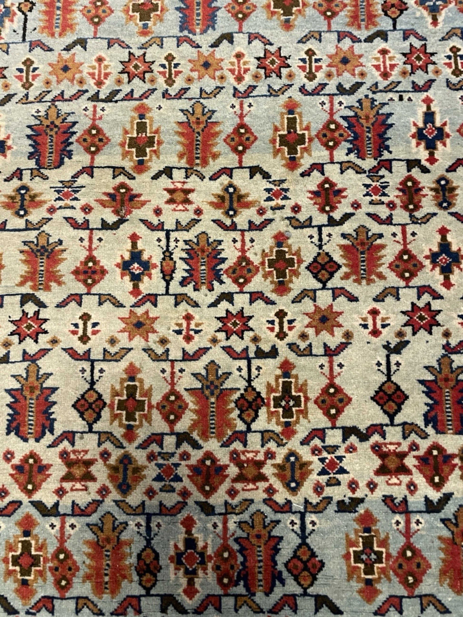 Color contrast between blue field and red motifs

