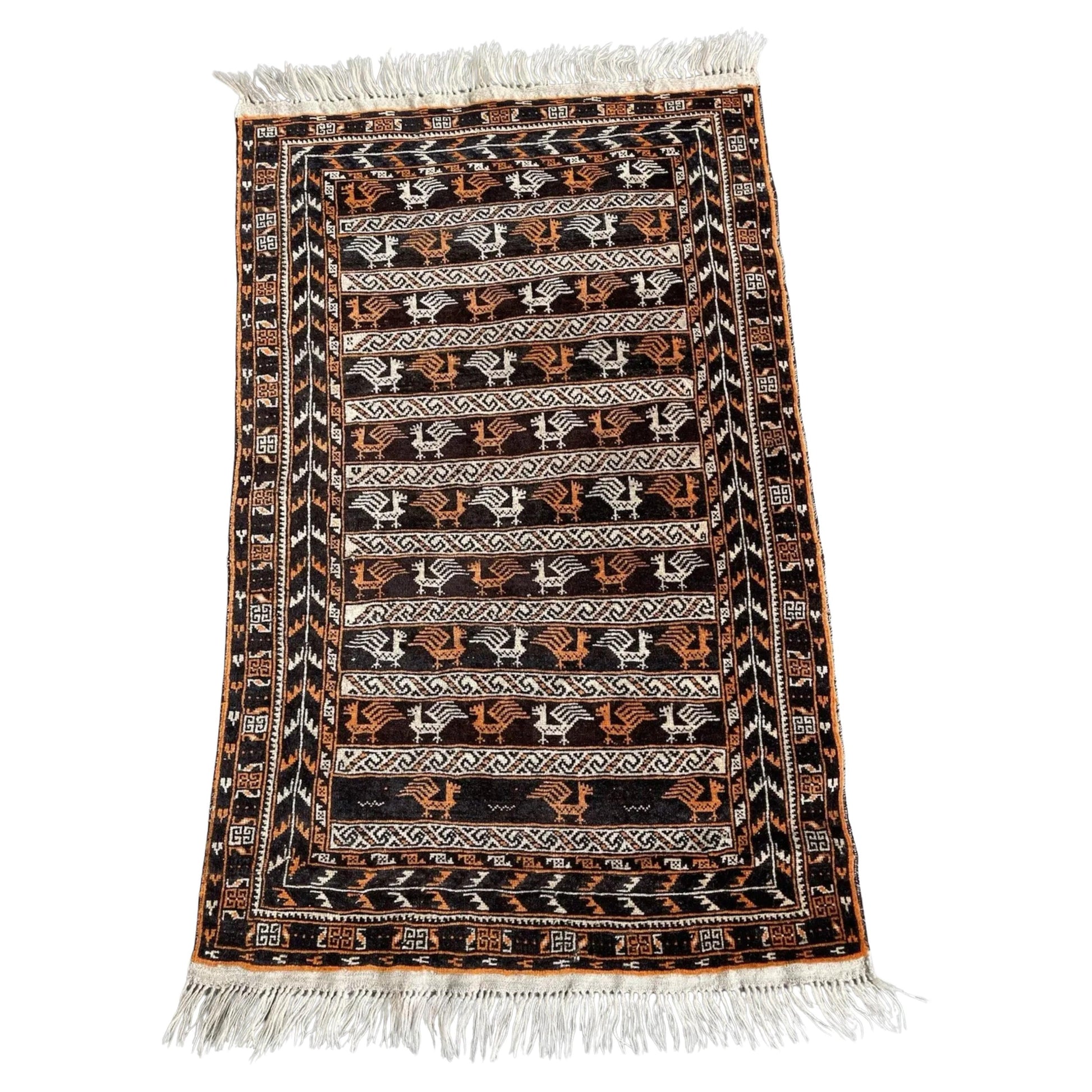 Antique Baluch rug with geometric tribal motifs

