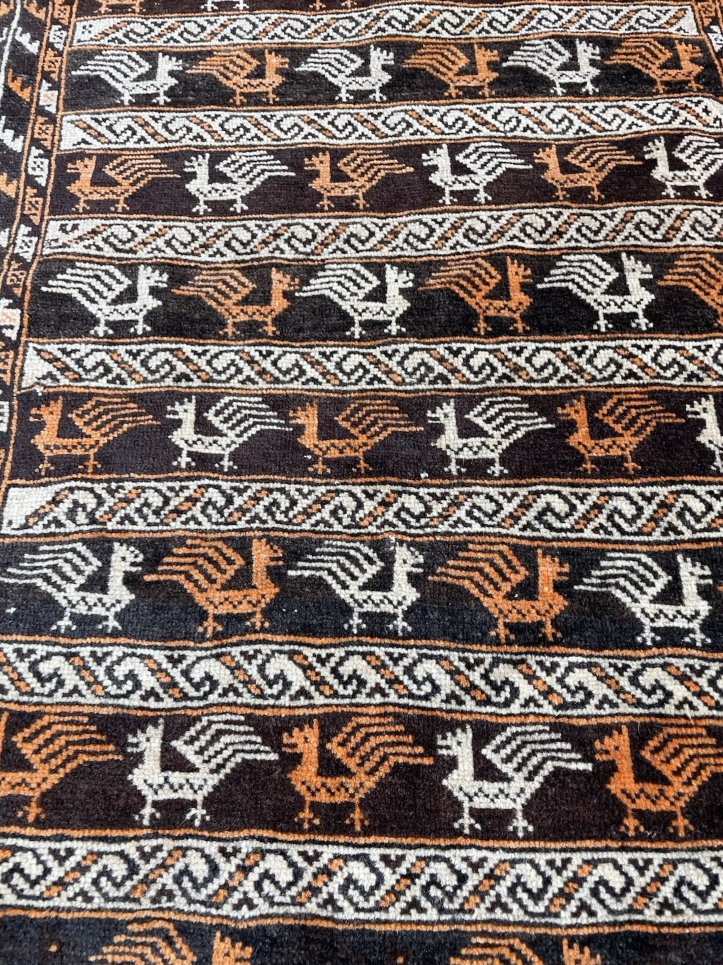 Color contrast between red field and dark motifs

