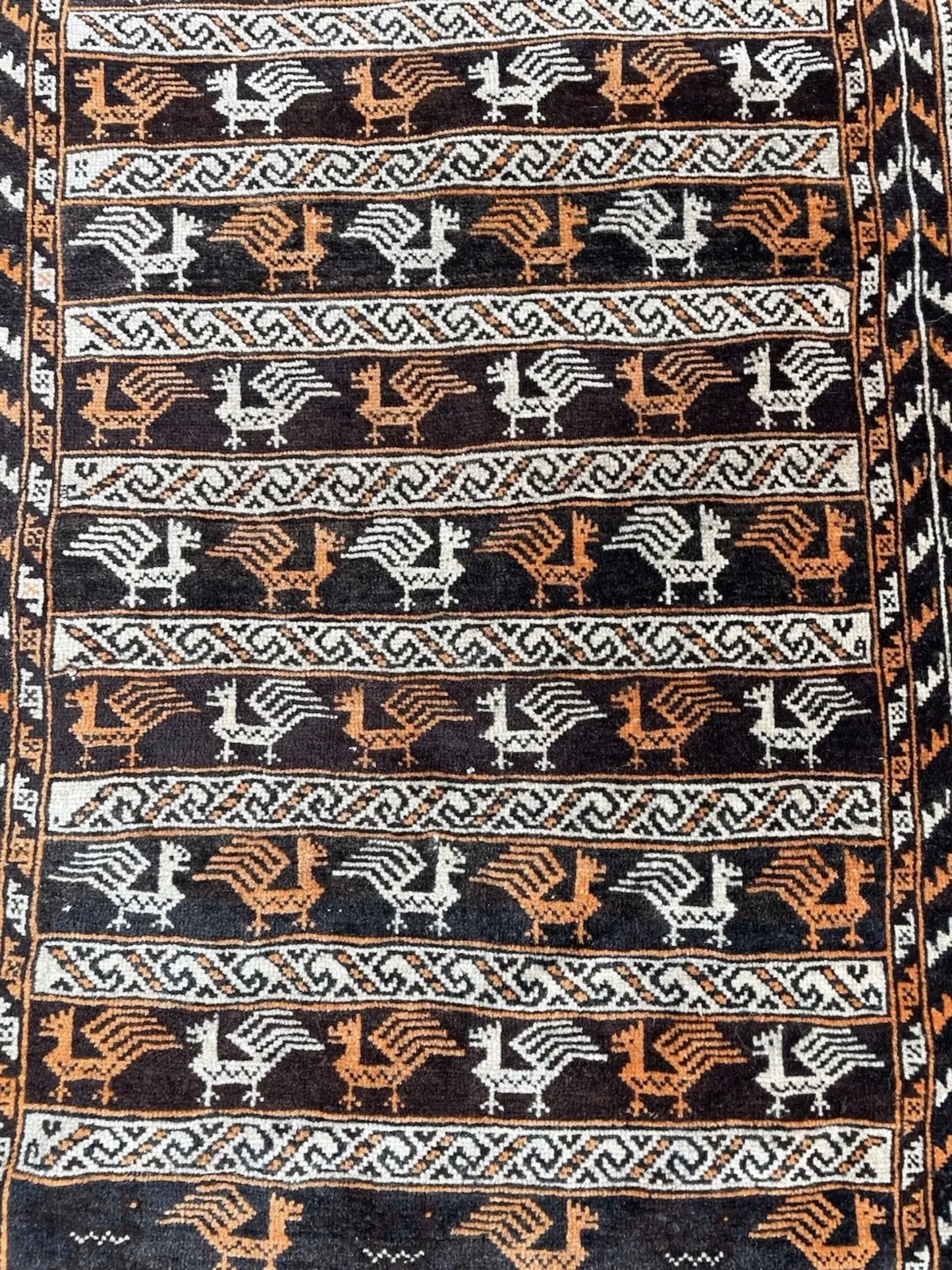 Repeating medallions on deep red field

