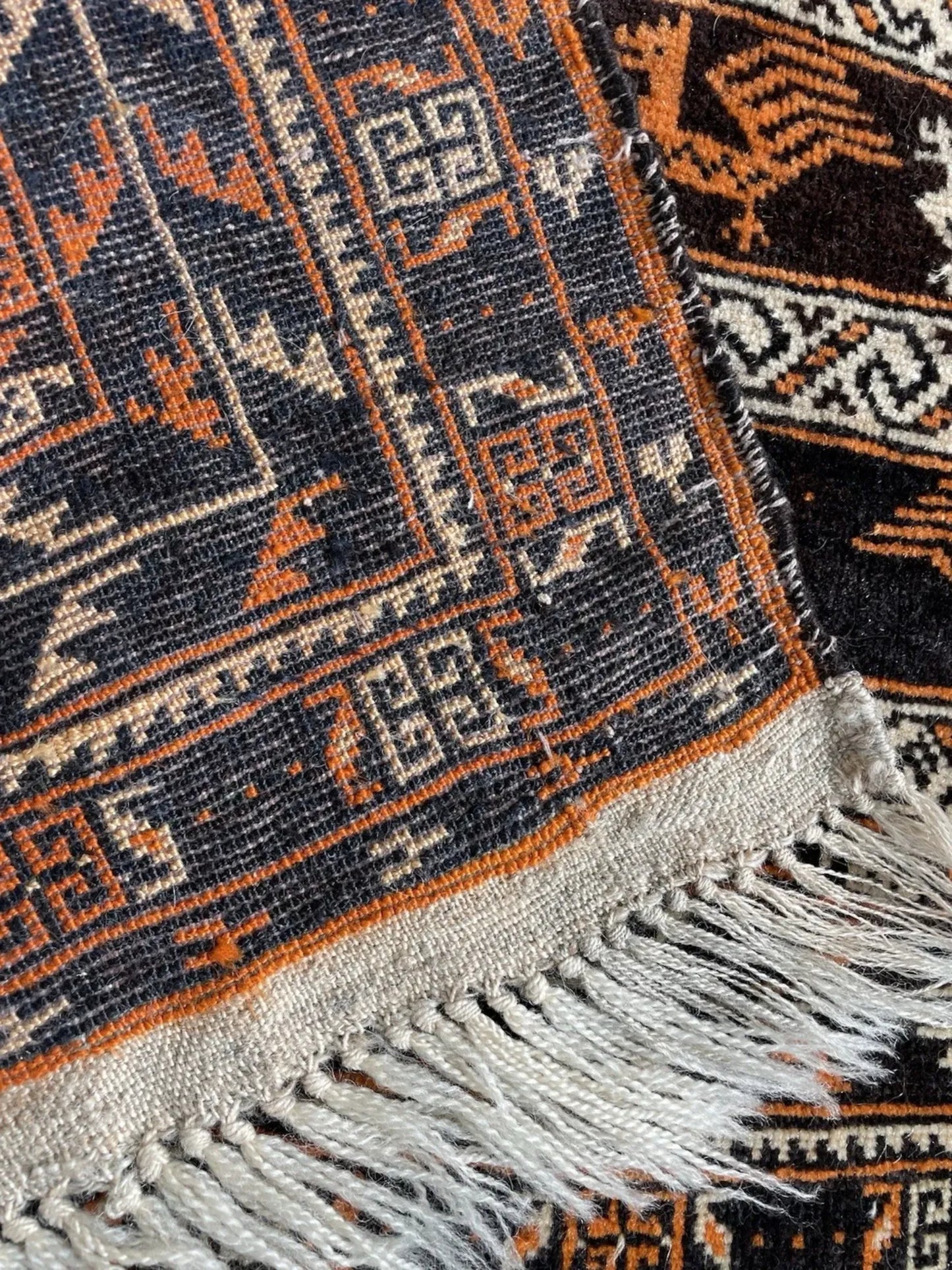 Dense wool texture with century-old patina

