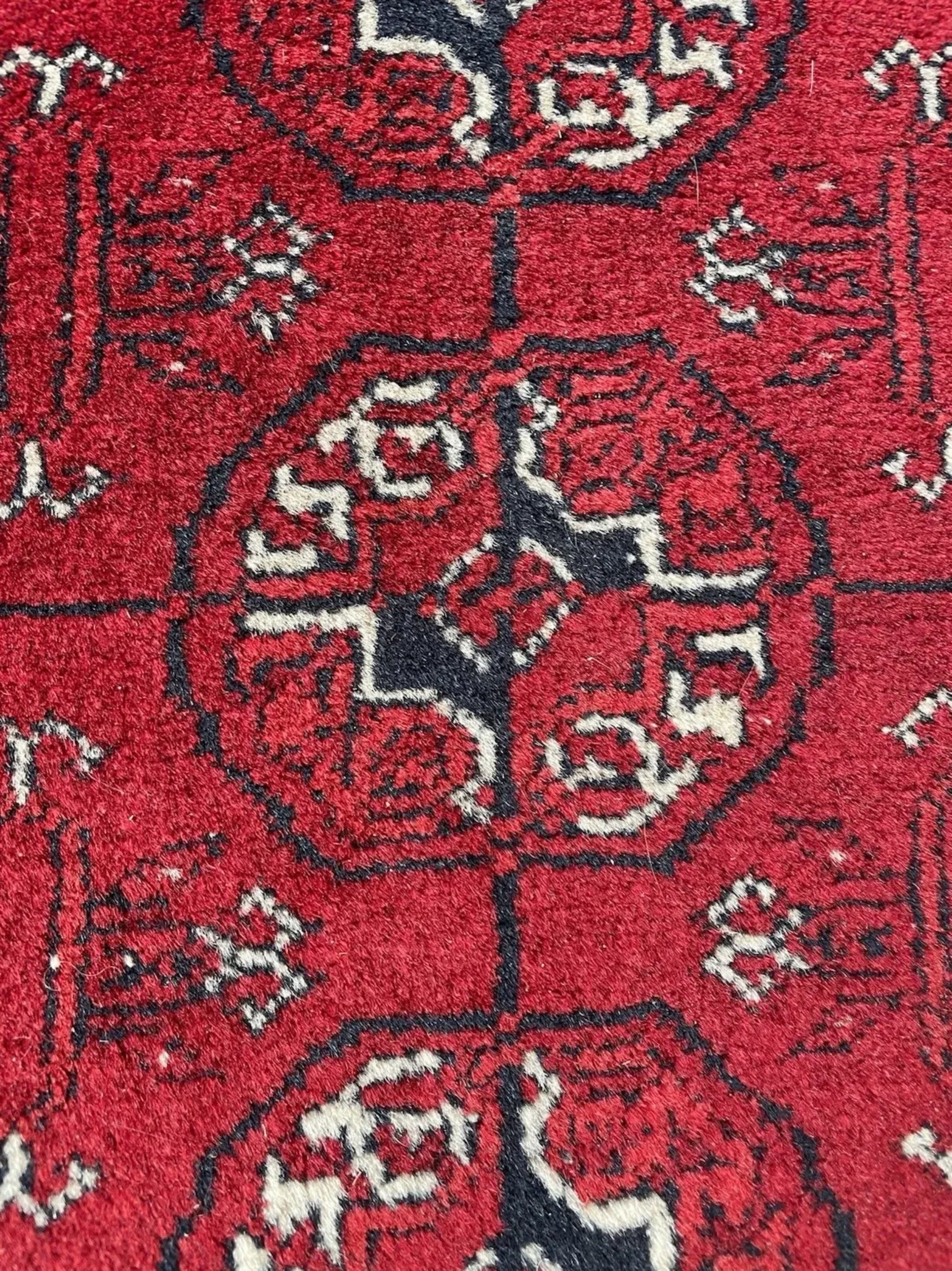 Rich rust and mahogany tones throughout pattern

