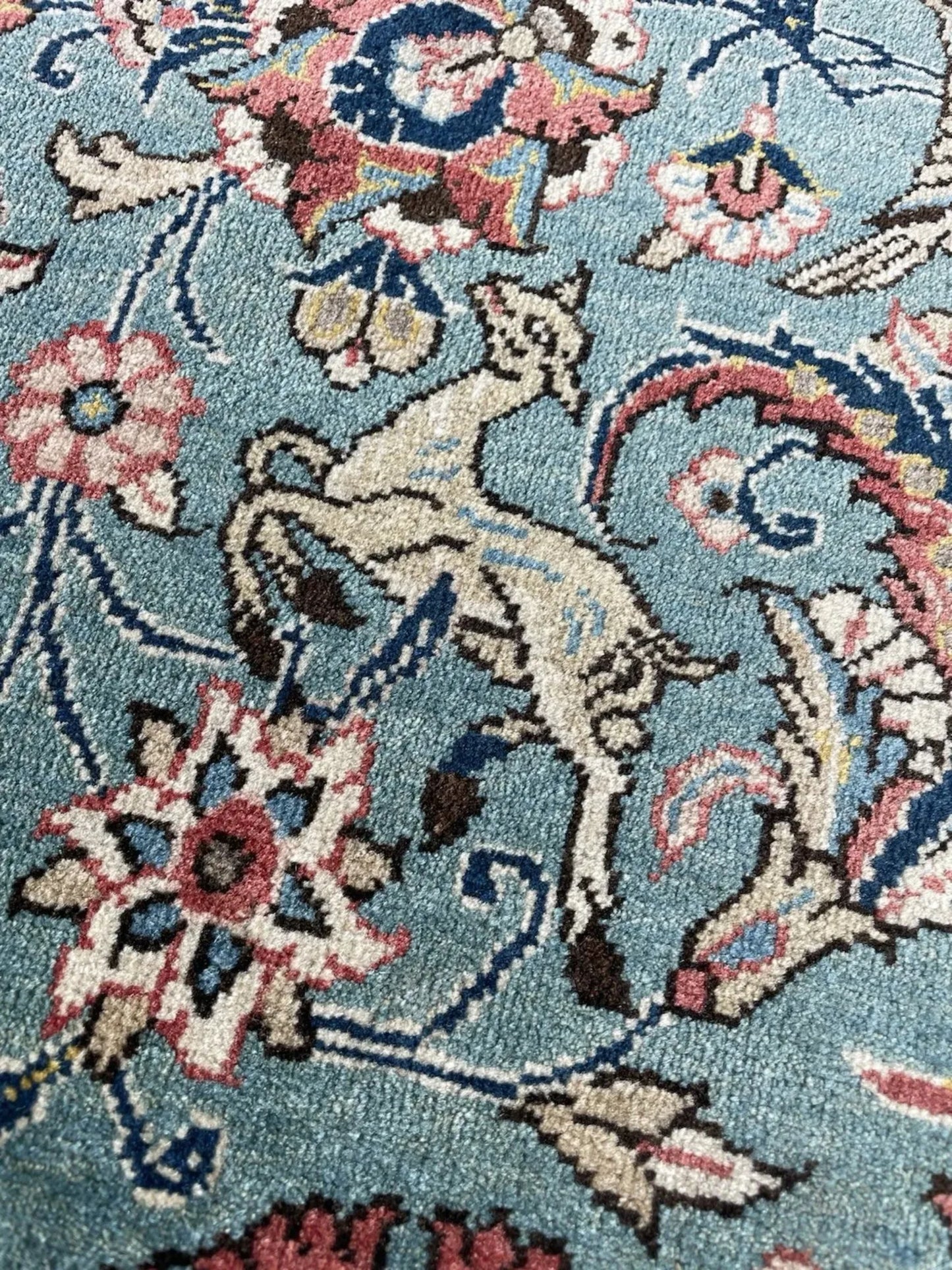 Broad floral border framing central field

