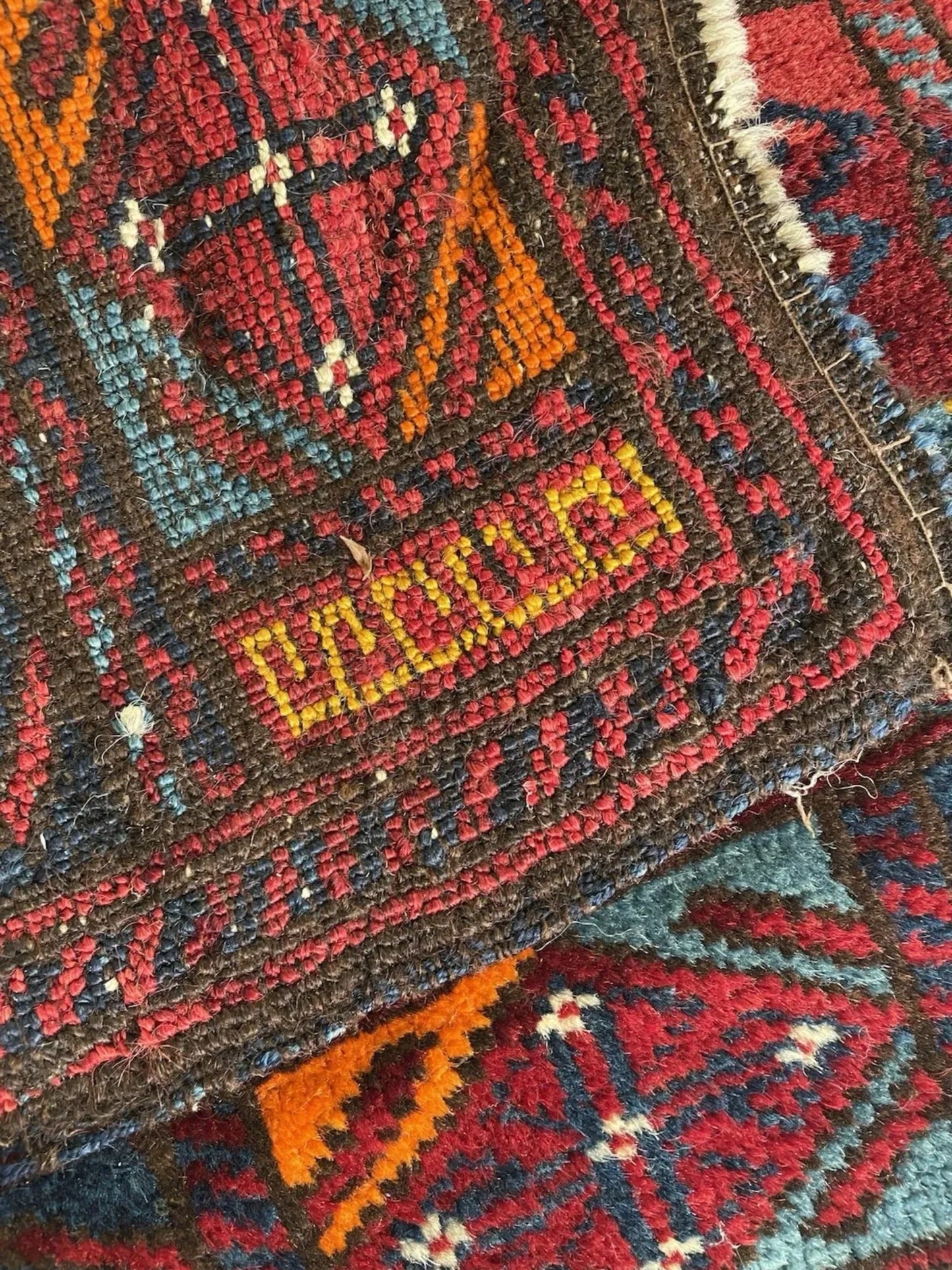 Bright orange and teal diamonds in border

