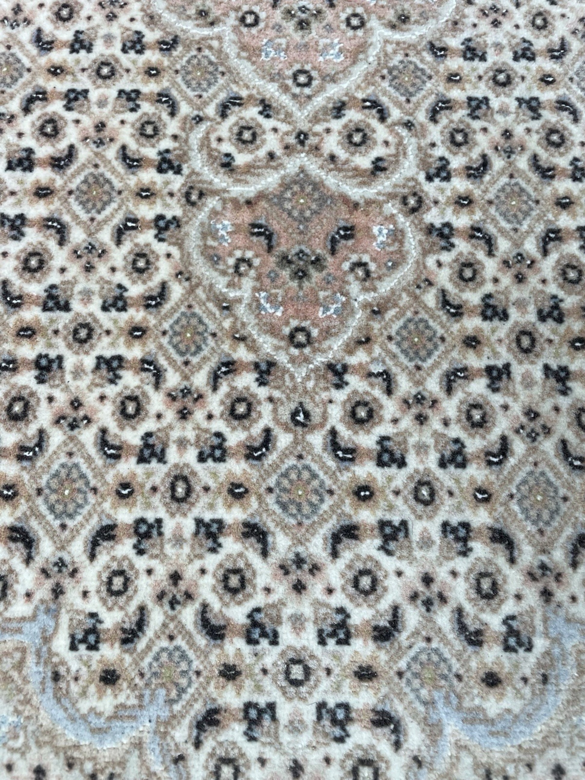 Individual rug showing complete medallion composition

