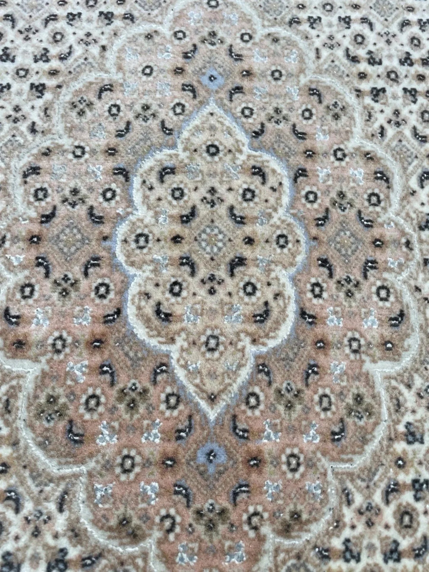 Subtle color variation between the two rugs

